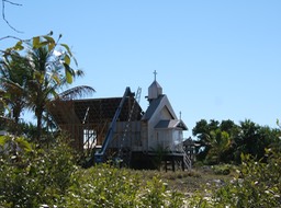Behind church