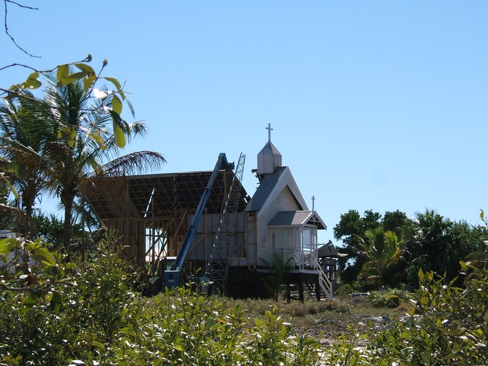 Behind church